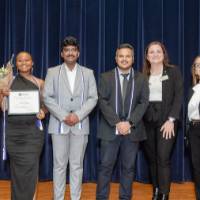 Naomi holding the flower.